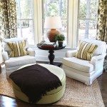 Two comfortable overstuffed chairs in a nicely decorated luxury sun-room